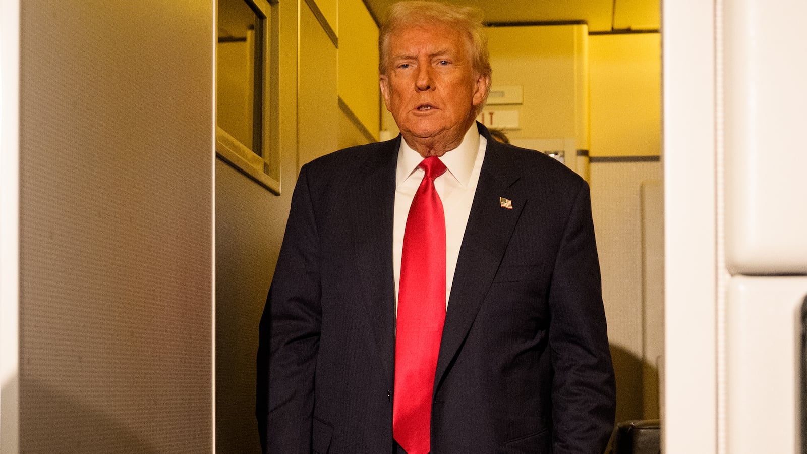 President Donald Trump prepares to speak to members of the media aboard Air Force One on October 30, 2025 in flight.