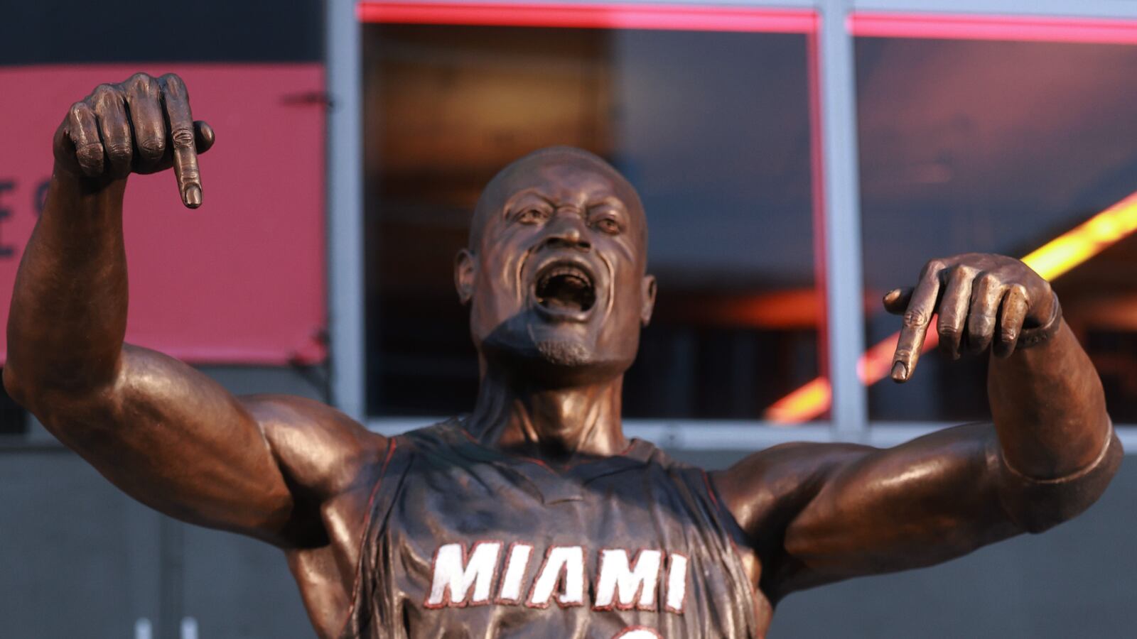 MIAMI, FLORIDA - OCTOBER 28: Dwyane Wade interacts with fans as they visit his statue that was unveiled on October 27th, prior to a game between the Miami Heat and the Detroit Pistons at Kaseya Center on October 28, 2024 in Miami, Florida. (Photo by Carmen Mandato/Getty Images)