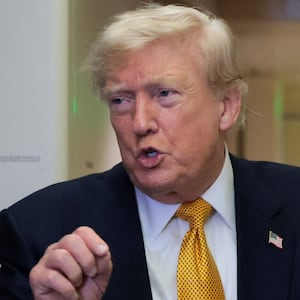 U.S. President Donald Trump speaks to reporters mid-flight in the press cabin of the new, Qatari-gifted Air Force One after changing planes to return to Washington from RAF Mildenhall, Britain, July 8, 2026. REUTERS/Jonathan Ernst