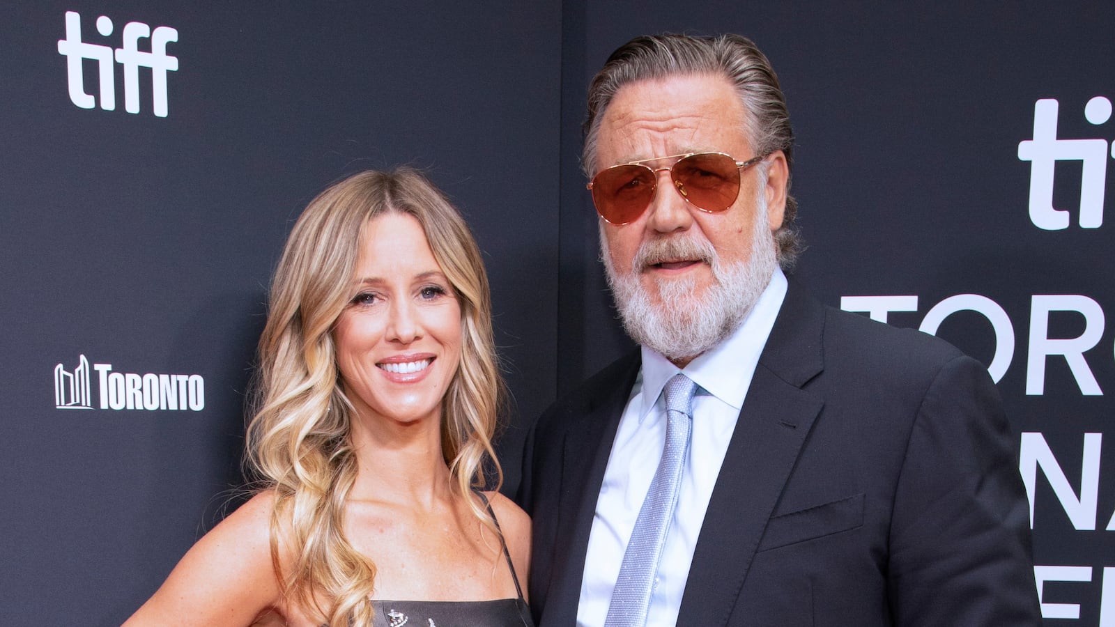 Britney Theriot and Russell Crowe attend the premiere of "Nuremberg".