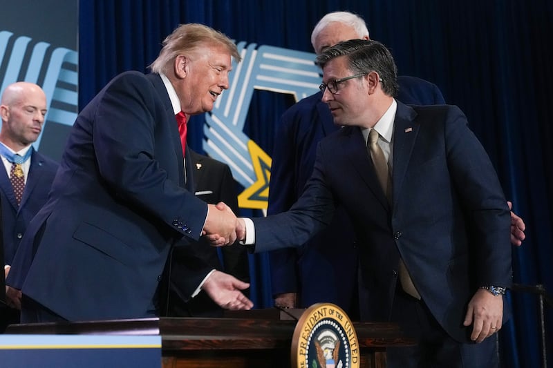 President Donald Trump shakes hands with Speaker of the House Mike Johnson during an event on September 10, 2026 in Arlington, Texas.