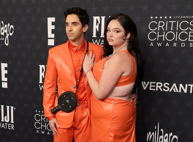 Paul W. Downs and Megan Stalter attend the 31st Annual Critics Choice Awards at Barker Hangar on January 04, 2026 in Santa Monica, California.