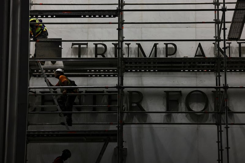 Workers prepare scaffolding ahead of removing lettering from the facade of the John F. Kennedy Memorial Center for the Performing Arts, following a federal judge’s order to remove U.S. President Donald Trump's name from the institution, in Washington, D.C., U.S., June 13, 2026.