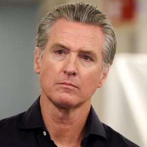 California Governor Gavin Newsom listens before speaking during a press conference announcing $11 insulin and prescription drugs with the CalRX program inside a Cedars-Sinai pharmacy in Los Angeles, California on October 16, 2025.
