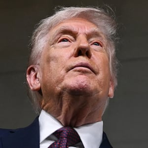 U.S. President Donald Trump speaks to journalists as he attends the world premiere of Amazon MGM Studios' "Melania" at the Kennedy Center in Washington, DC, on January 29, 2026.