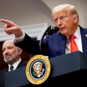 U.S. President Donald Trump takes a question from a reporter.