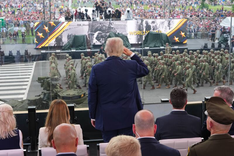 President Donald Trump stands and salutes troops during the celebration of the Army's 250th birthday on the National Mall on June 14, 2025 in Washington, DC.