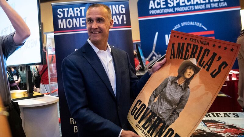 Corey R. Lewandowski holds a poster for South Dakota Gov. Kristi Noem during the Conservative Political Action Conference CPAC held at the Hyatt Regency Orlando on Saturday, Feb 27, 2021 in Orlando, FL.