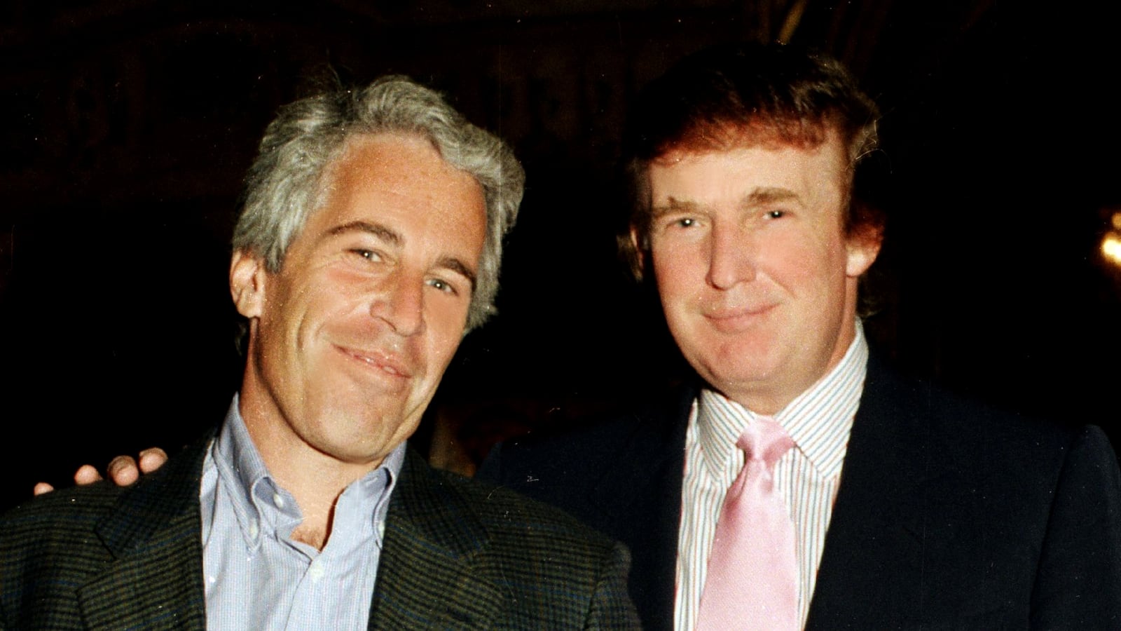 Jeffrey Epstein (left) and Donald Trump as they pose together at the Mar-a-Lago estate, Palm Beach, Florida on February 22, 1997.