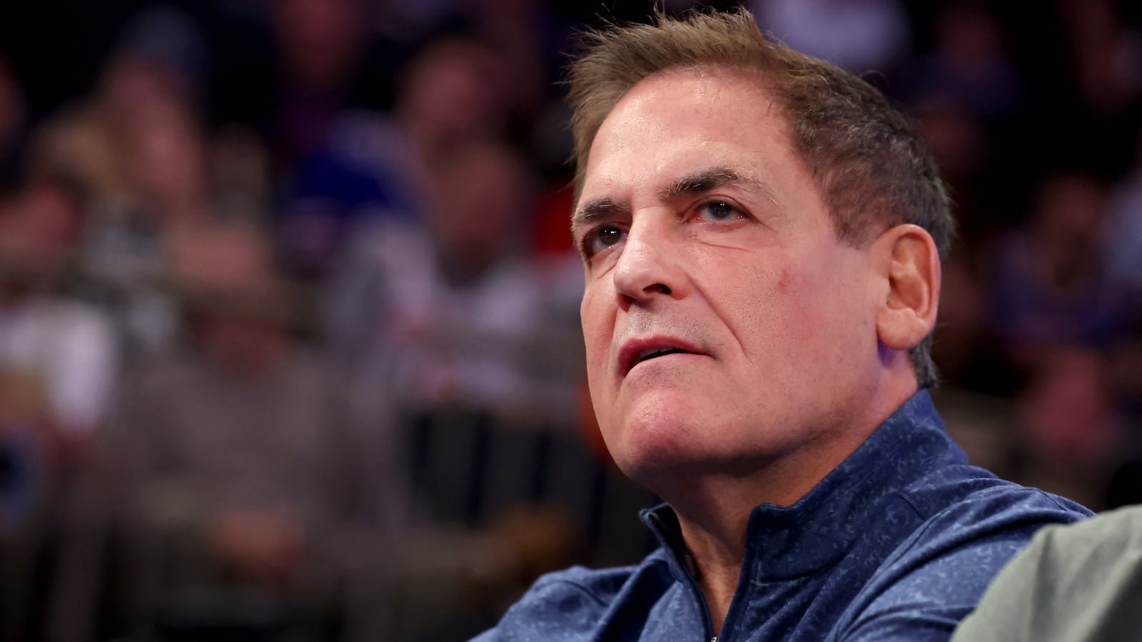 Mark Cuban stares forward at an NBA game.