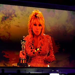 HOLLYWOOD, CALIFORNIA - NOVEMBER 16: Dolly Parton accepts an Academy Honorary Award via video during the 16th Governors Awards at The Ray Dolby Ballroom on November 16, 2025 in Hollywood, California. (Photo by Kevin Winter/Getty Images)