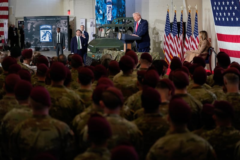 FORT BRAGG, NORTH CAROLINA - FEBRUARY 13: U.S. President Donald Trump and first lady Melania Trump visit the Fort Bragg U.S. Army base on February 13, 2026 in Fort Bragg, North Carolina. Trump visited the base to honor special forces involved in the military operation in Venezuela in early 2026. (Photo by Nathan Howard/Getty Images)