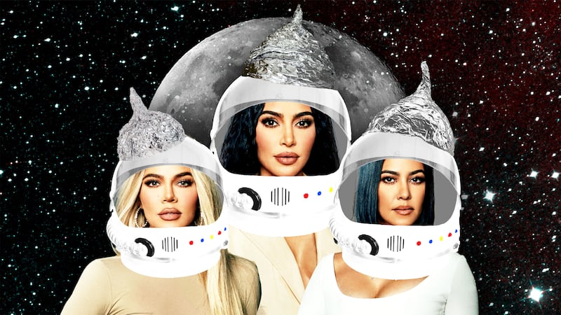 Kim Kardashian, Khloe Kardashian, Kourtney Kardashian wearing astronaut helmets with tinfoil hats on top in front of the Moon