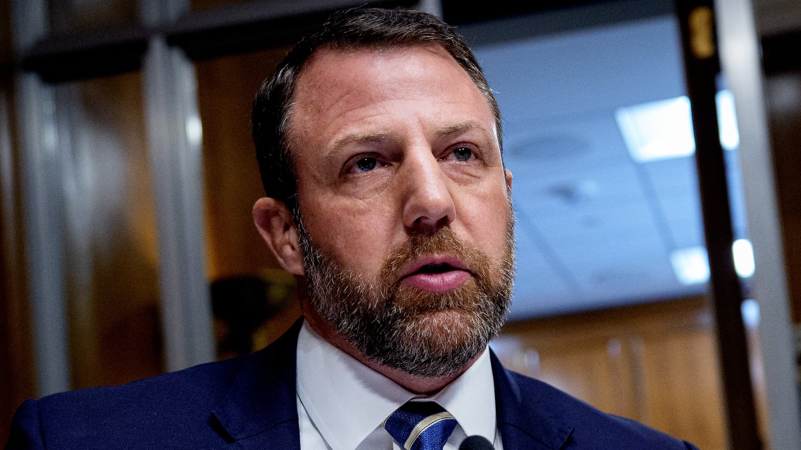 WASHINGTON, DC - FEBRUARY 25: Sen. Markwayne Mullin (R-OK) (L), accompanied by Sen. Roger Marshall (R-KS) (R), speaks during a nomination hearing for Dr. Casey Means, for the medical director in the Regular Corps of the Public Health Service and U.S. surgeon general during a Senate Health, Education, Labor and Pensions Committee hearing on Capitol Hill on February 25, 2026 in Washington, DC. Means, a health influencer, will make her case to be the next surgeon general. (Photo by Andrew Harnik/Getty Images)