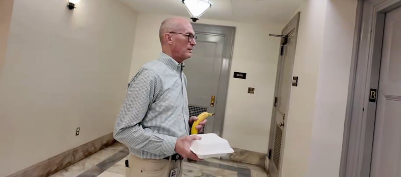 Terry Carmack entering an elevator.