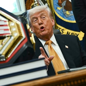 A UFC championship belt is displayed as US President Donald Trump speaks about the upcoming "UFC Freedom 250" event, in the Oval Office of the White House on May 6, 2026, in Washington, DC. An Ultimate Fighting Championship event will be staged on the White House's South Lawn in June. The June 14 event has been dubbed "UFC Freedom 250," in reference to the United States' 250th anniversary celebrations this summer. (Photo by Kent NISHIMURA / AFP via Getty Images)