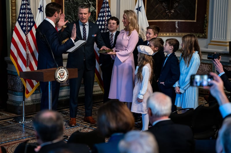 WASHINGTON, DC - JANUARY 25: U.S. Vice President J.D. Vance ceremonially swears in newly confirmed Secretary of Defense Pete Hegseth while Hegseth's wife, Jennifer Rauchet, and their seven children look on, during a swearing-in ceremony in the Indian Treaty Room at the Eisenhower Executive Office Building on January 25, 2025 in Washington, DC. The Senate confirmed Pete Hegseth as Defense secretary in a 51-50 vote, with Vice President J.D. Vance breaking the tie after three Republicans joined Democrats in opposition the second time in history that a vice president has broken a tie for a Cabinet nominee. The first was Betsy DeVos in 2017.