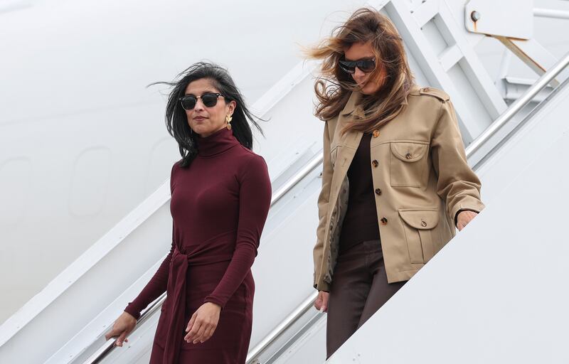 RICHLANDS, NORTH CAROLINA - NOVEMBER 19: Second lady Usha Vance (L) and first lady Melania Trump depart a plane as they arrive at Albert J. Ellis Airport en route to Camp Lejeune on November 19, 2025 in Richlands, North Carolina. Trump and Vance are traveling together for the day to visit military families and schools at Marine Corps Base Camp Lejeune. (Photo by Anna Moneymaker/Getty Images)
