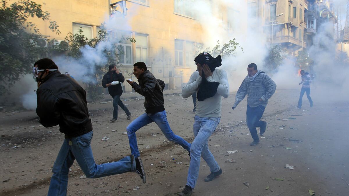 articles/2011/11/21/egypt-protests-civilian-cabinet-quits-over-crackdown/egypt-protesters-gas-cheat_qo6yvp