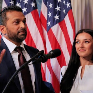 FBI Director Kash Patel speaks as his girlfriend Alexis Wilkins (C) looks on during his swearing-in ceremony on Feb. 21, 2025, in Washington, DC.