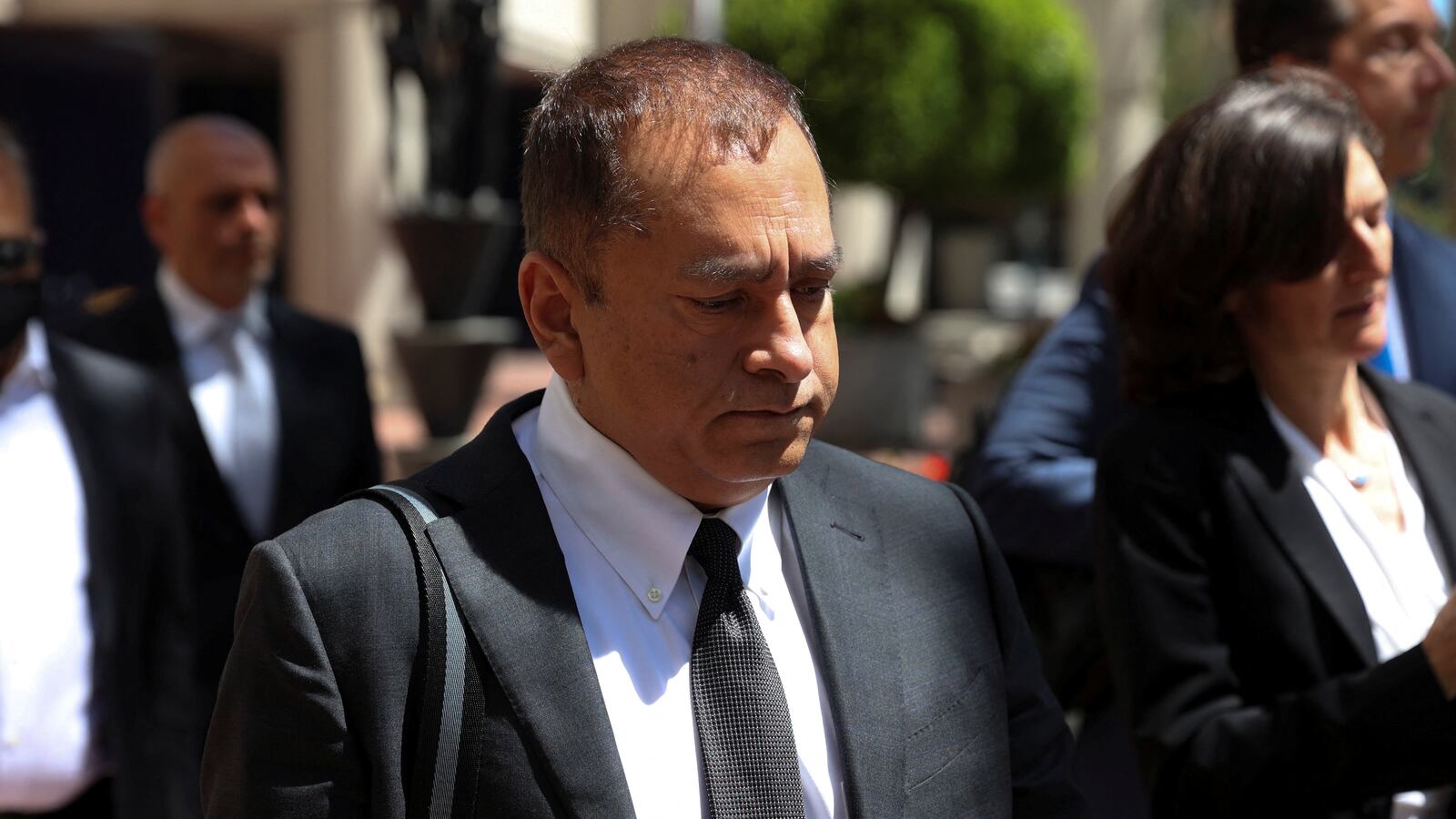 Sunny Balwani walks to his federal trial in 2022.