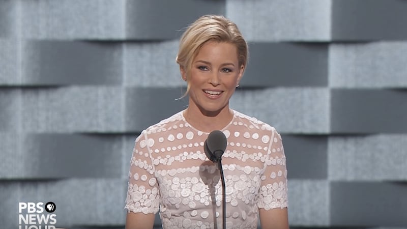 articles/2016/07/26/elizabeth-banks-trolls-trump-at-dnc-a-cruel-out-of-touch-reality-tv-star-who-wears-insane-wigs/160726-wilstein-elizabeth-banks-tease_jwjjuu