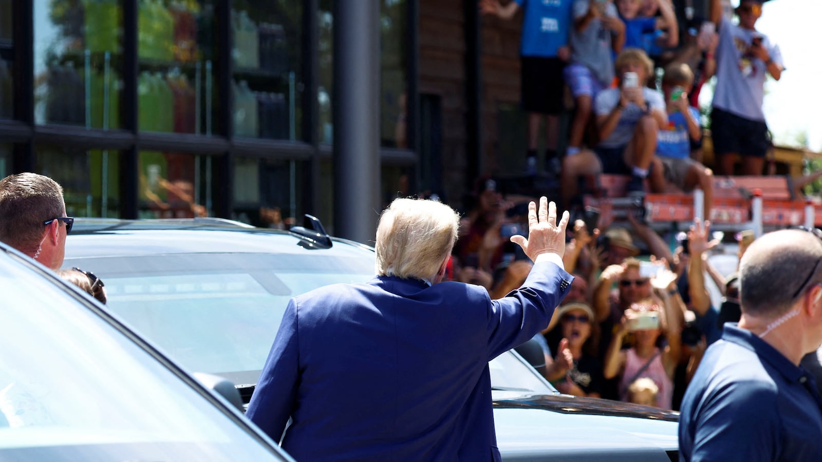 Republican presidential candidate and former U.S. President Donald Trump waves as he campaigns at the Iowa State Fair in Des Moines, Iowa, U.S. August 12, 2023.