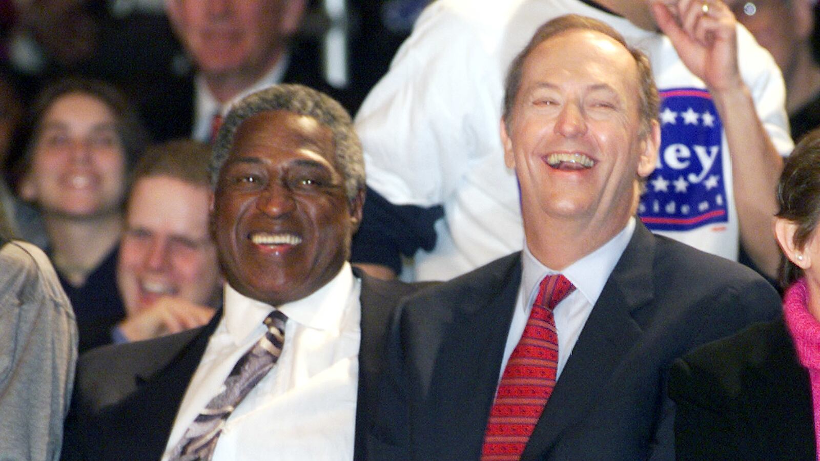 Willis Reed sits on the sidelines along Bill Bradley