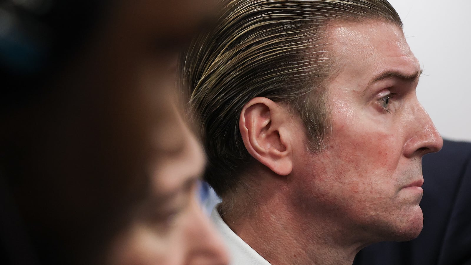 ARLINGTON, VIRGINIA - MARCH 06: Pentagon Press Secretary John Ullyot listens as U.S. Secretary of Defense Pete Hegseth answers a reporter's question while meeting with UK Defense Secretary John Healey at the Pentagon with members of their respective teams on March 6, 2025 in Arlington, Virginia. Healey is meeting with Hegseth to discuss a possible peace plan for Ukraine. (Photo by Win McNamee/Getty Images)