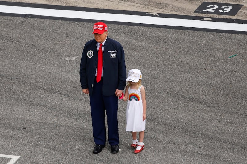 DAYTONA BEACH, FLORIDA - FEBRUARY 16: U.S. President Donald Trump stands on the grid during pre-race ceremonies prior to the NASCAR Cup Series Daytona 500 at Daytona International Speedway on February 16, 2025 in Daytona Beach, Florida. (Photo by Mike Ehrmann/Getty Images)