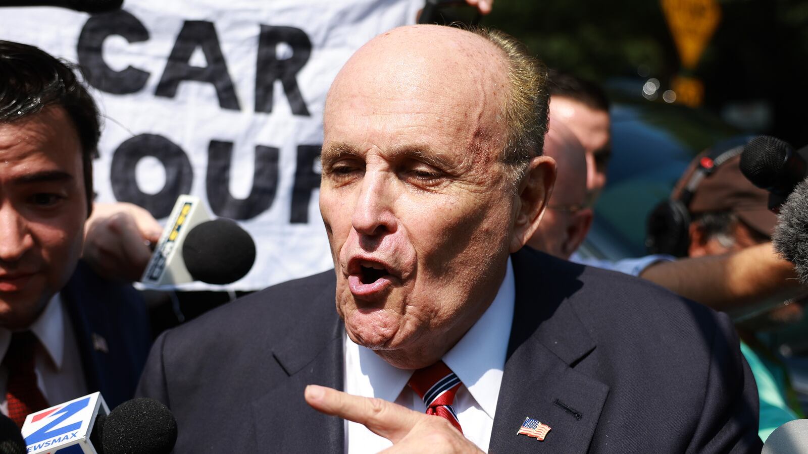 Rudy Giuliani speaks to the media after leaving the Fulton County jail on August 23, 2023 in Atlanta, Georgia. Giuliani is one of 19, including former President Donald Trump, facing felony charges in the indictment related to tampering with the 2020 election in Georgia who have been ordered to turn themselves in by August 25.