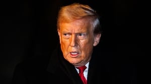 President Donald Trump walks over to reporters to make a brief statement before departing from the South Lawn of the White House in Marine One on January 20, 2026 in Washington, DC.