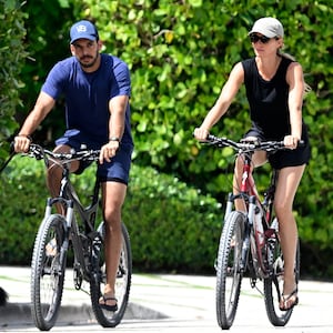 SURFSIDE, FL - JULY 14: Joaquim Valente and Gisele Bündchen are seen on a bike ride on July 14, 2024 in Surfside, Florida. (Photo by MEGA/GC Images)