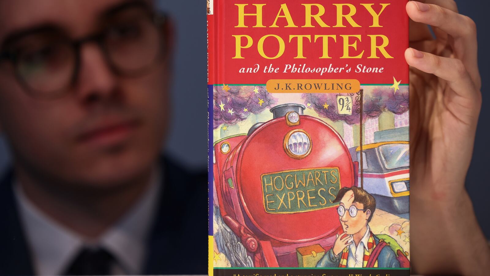 A first edition and signed by the author copy of 'Harry Potter and the Philosophers Stone' by British author J.K. Rowling.