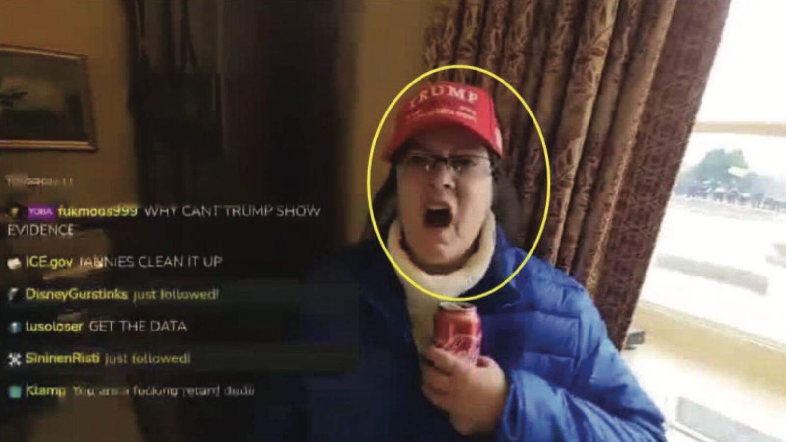 A screenshot of Jan. 6 defendant Sandra Lee Hodges inside the Capitol, yelling at the camera while wearing a red MAGA hat.