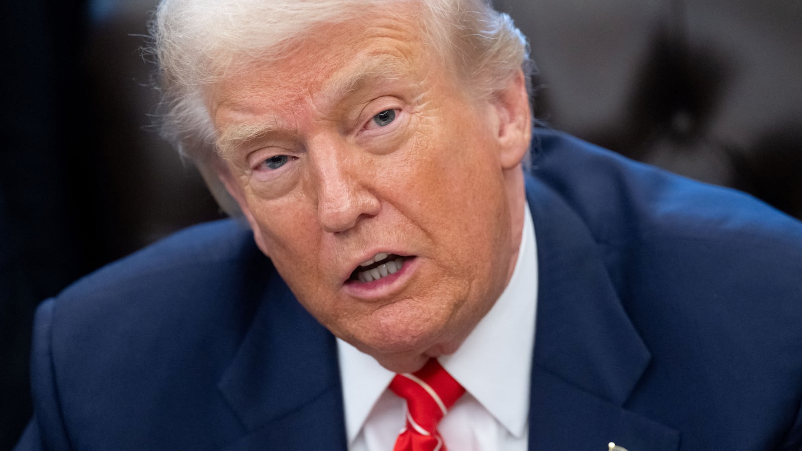 US President Donald Trump speaks with the media after signing a funding bill to end a partial government shutdown in the Oval Office of the White House in Washington, DC, February 3, 2026.