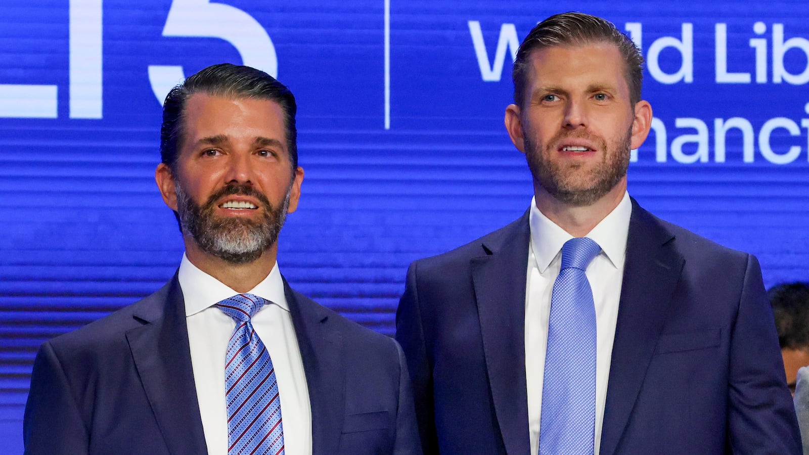NEW YORK, NEW YORK - AUGUST 13: Eric Trump (center), the newly appointed ALT5 Board Director of World Liberty Financial, is joined by his brother and ALT5 Board Observer Donald Trump Jr. (left), and Zach Witkoff, Co-Founder and CEO of World Liberty Financial to mark the $1.5B partnership between World Liberty Financial (WLFI) and ALT5 Sigma with the ringing of the NASDAQ opening bell on August 13, 2025 in New York City. The deal, in which ALT5 Sigma acquired 7.5 percent of the total WLFI token supply, marks a step in merging traditional finance with digital assets. (Photo by Spencer Platt/Getty Images)