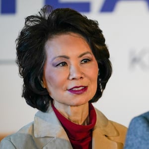 U.S. Secretary of Transportation Elaine Chao stands with her husband, Senate Majority Leader Mitch McConnell, at his final campaign event of the 2020 campaign for U.S. Senate, in Versailles, Kentucky, U.S., November 2, 2020. Picture taken November 2, 2020.  REUTERS/Bryan Woolston