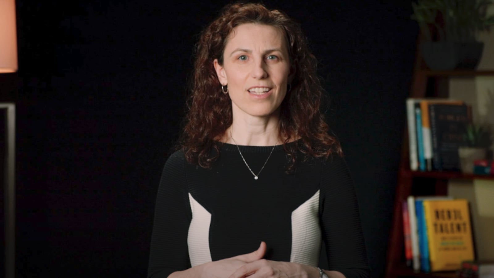 A video of Francesca Gino speaking next to a bookshelf.