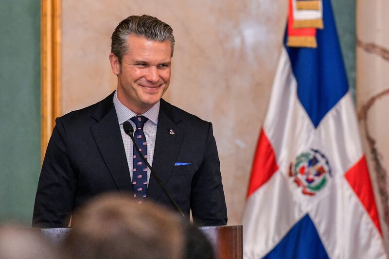 US Secretary of Defense Pete Hegseth smiles during a press conference at the Dominican National Palace in Santo Domingo on November 26, 2025.