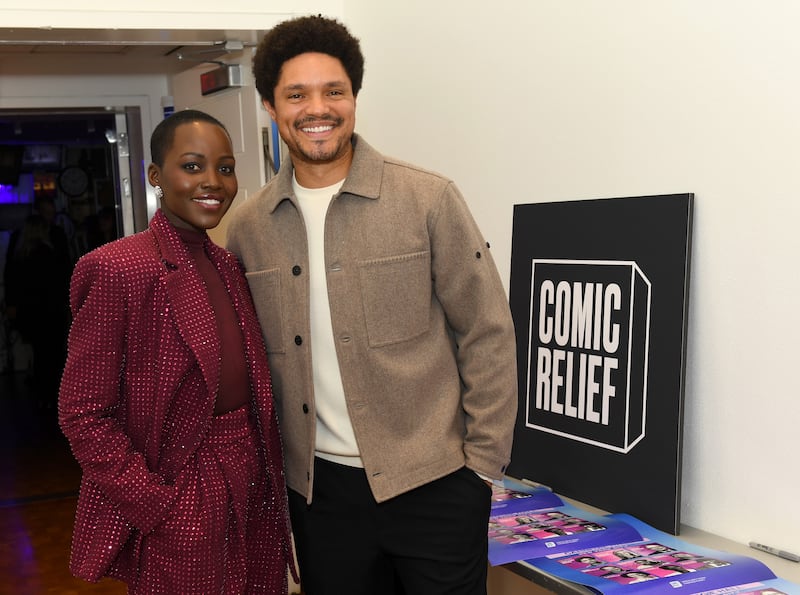 NEW YORK, NEW YORK - DECEMBER 10: (L-R) Lupita Nyong'o and Trevor Noah attend the Comic Relief Live 2025: A Benefit to Build Brighter Futures for Kids at Carnegie Hall on December 10, 2025 in New York City.