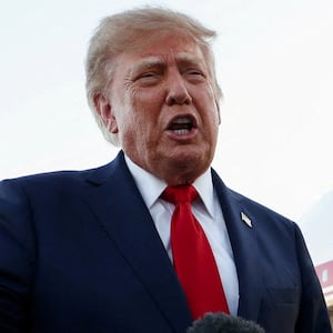 FILE PHOTO: U.S. President Donald Trump speaks to members of the press as he arrives at Charlotte Douglas International Airport, while he travels to attend a campaign rally supporting Republican U.S. Senate candidate Michael Whatley, in Charlotte, North Carolina, U.S., September 16, 2026.  REUTERS/Kevin Lamarque/File Photo