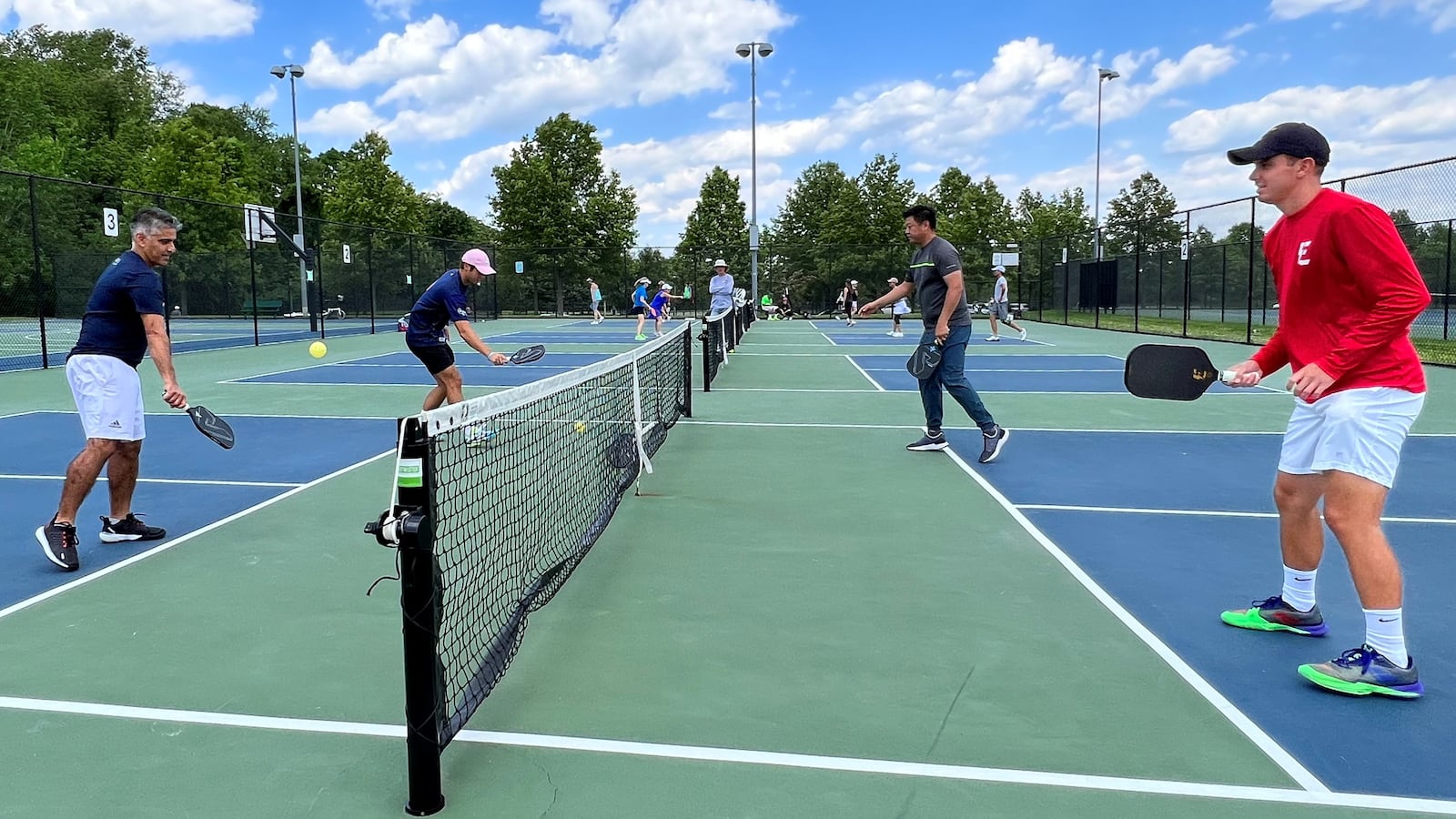 Profession pickleball player Ben Johns (2nd L) plays with his older brother Collin Johns.