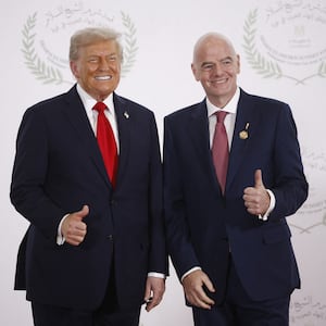 FIFA President Gianni Infantino (R) and US President Donald Trump pose during a summit on Gaza in Sharm el-Sheikh.