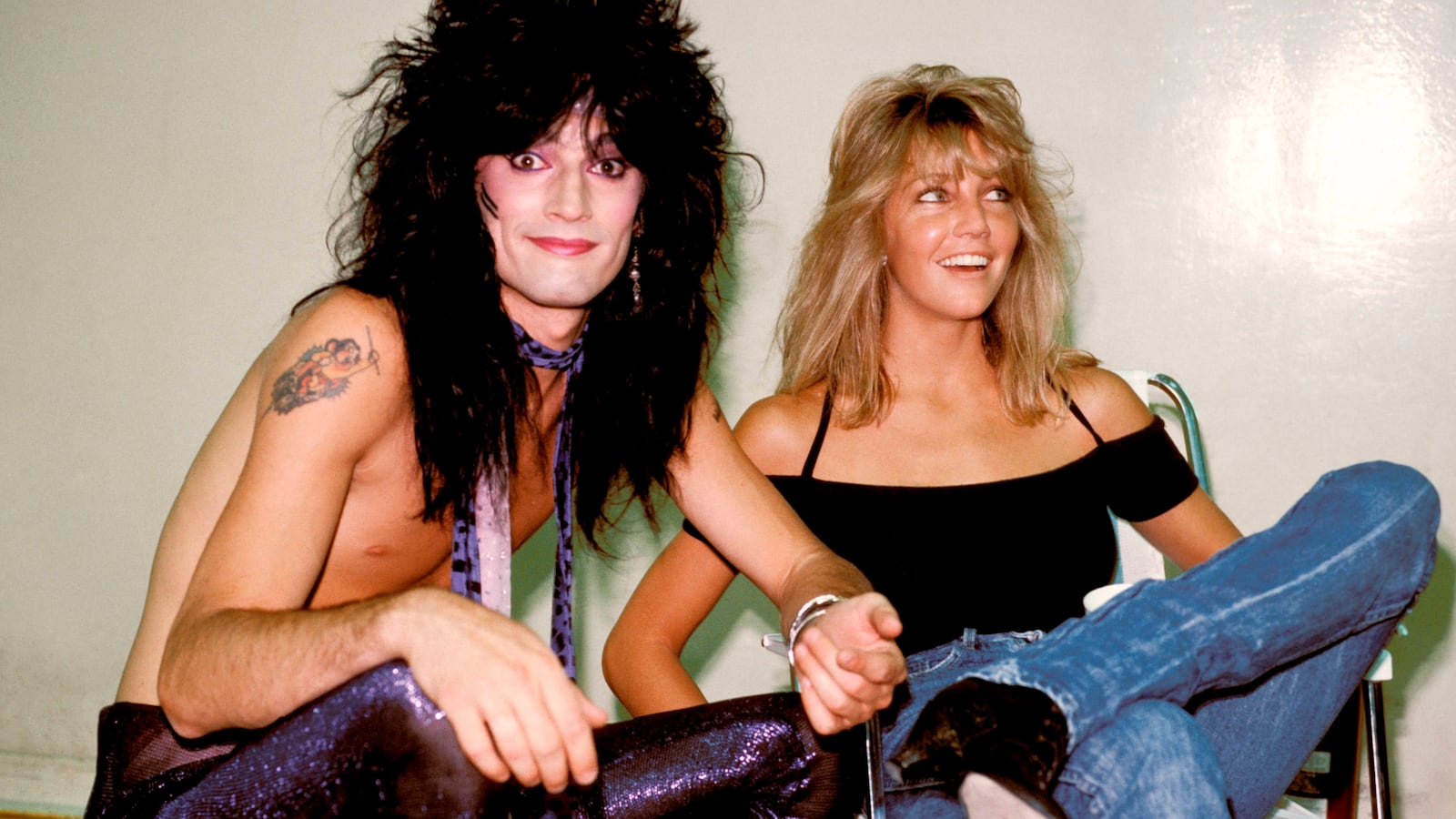 Tommy Lee of Motley Crue poses backstage with wife Heather Locklear. (Photo by Richard E. Aaron/Redferns)