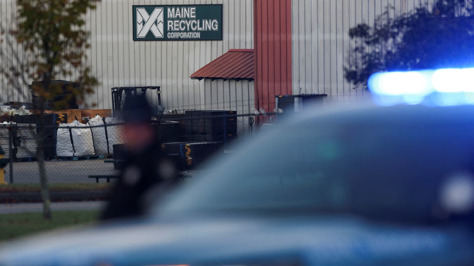 Law enforcement officials work at the scene where the body of Robert Card, the suspect in the mass shootings in Lewiston, was found in Lisbon Falls, Maine, U.S., October 28, 2023