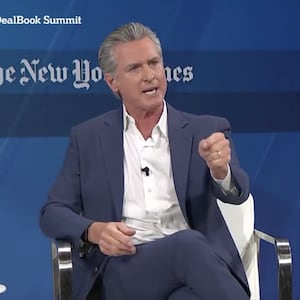 Gavin Newsom speaks on stage during the 2025 DealBook Summit.