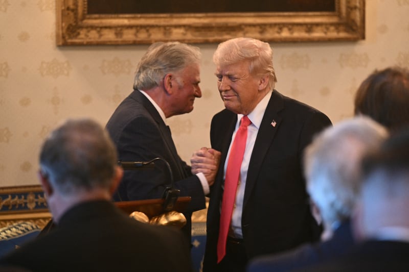 Rev. Franklin Graham shakes hands with US President Donald Trump after addressing an Easter prayer service and dinner in the Blue Room of the White House in Washington, DC, on April 16, 2025.