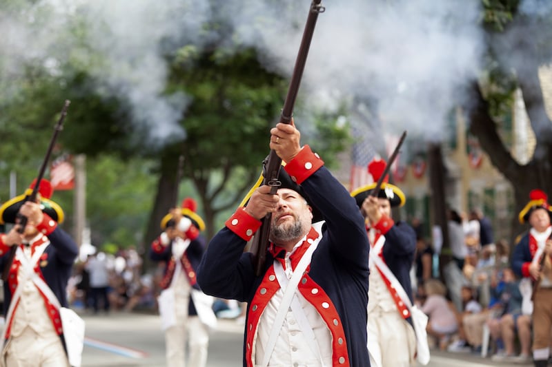 Parade members march during the 236th annual Military, Civic, and Firemen's Parade as part of 4th of July celebrations in Bristol, Rhode Island, U.S., July 5, 2021.