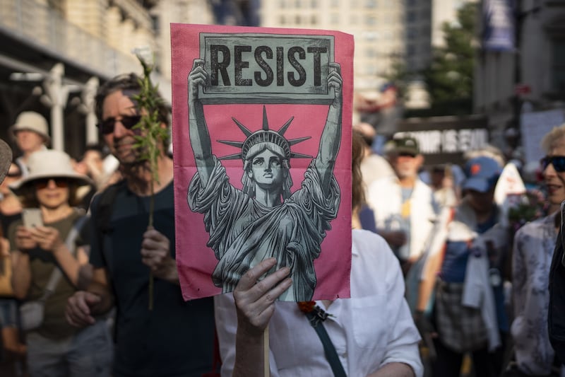 People take part in a rally and march denouncing the Trump administration's immigrations polices in New York City on July, 17, 2025.